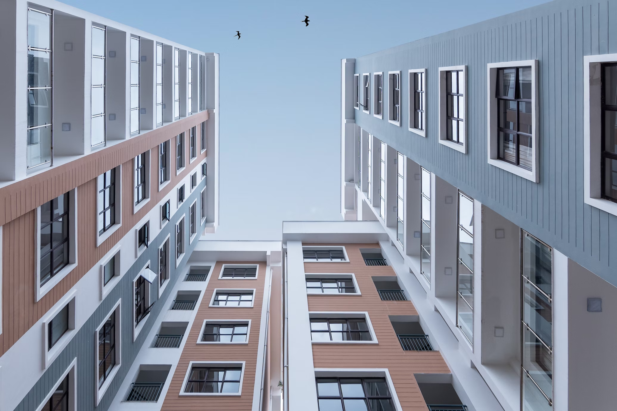 Low angle view of a modern apartment building facade